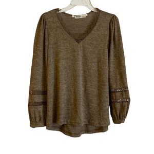 Available Angela Fashion Small light brown long sleeve top w/crochet detail.